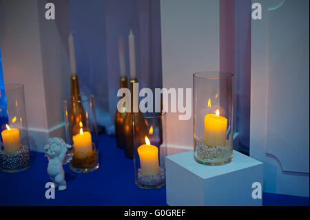 Original wedding decoration in form mini-vases and bouquets of flowers on ceremony Stock Photo