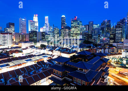 South East Asia, Singapore, Chinatown, Buddha Tooth Relic temple with city back drop Stock Photo