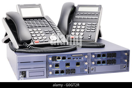 Phone switch system and two digital telephone sets isolated on white Stock Photo