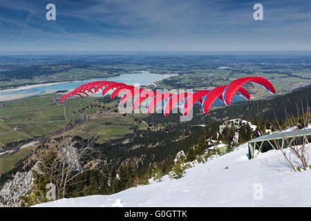 Paraglider sequence red in Bavaria Stock Photo