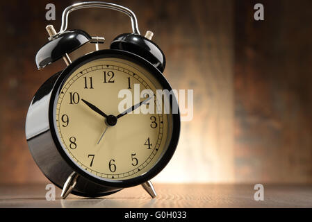 Composition with old black alarm clock. Stock Photo