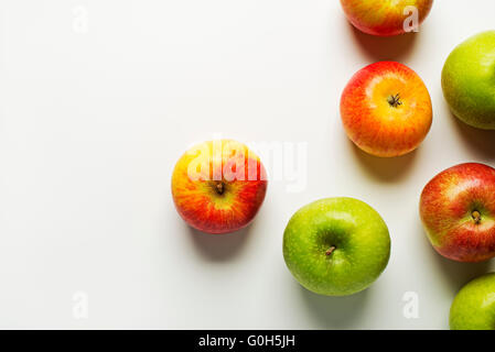 Red and green apples on white background. Stock Photo