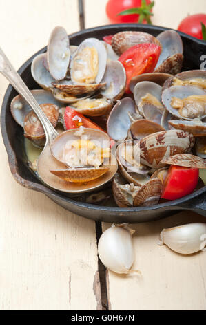 fresh clams on an iron skillet Stock Photo