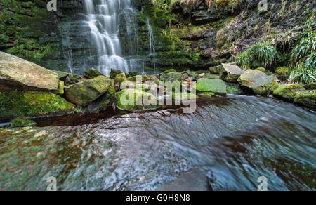 Clear Waterfall Cascade and Stones Covered in Green Moss Stock Photo