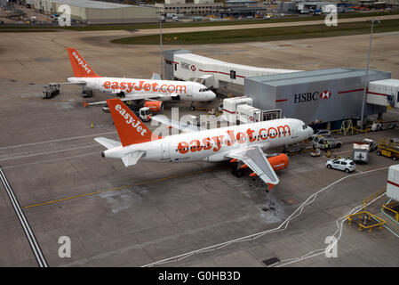 Easyjet passenger aircraft on the apron at London Gatwick Airport in Southern England UK