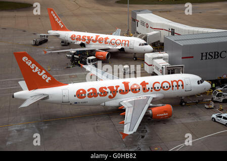 Easyjet passenger aircraft on the apron at London Gatwick Airport in Southern England UK Stock Photo