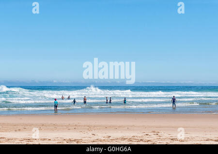 NATURES VALLEY, SOUTH AFRICA - MARCH 2, 2016: Unidentified swimmers at a beach at the small town of Natures Valley Stock Photo