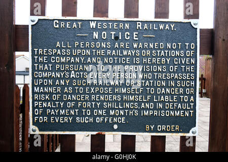 Old cast iron railway warning notice at Sandford station, in Somerset. May 2016 Stock Photo