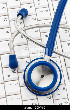 Computer keyboard and stethoscope. IT for physicians. Stock Photo