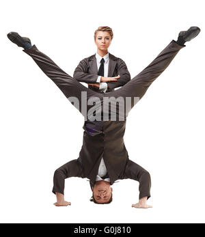 Two handsome acrobats posing in official suits Stock Photo