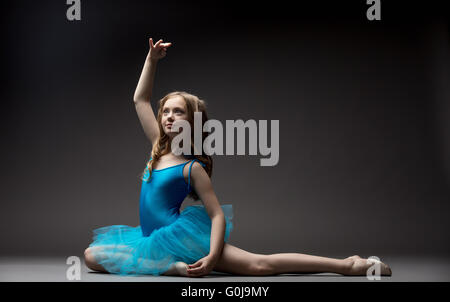 Lovely little ballerina inspired dancing in studio Stock Photo