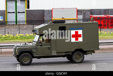 A British Army Battlefield Ambulance Land Rover travelling along the Kingsway West Dual Carriageway in Dundee, UK Stock Photo