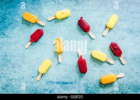popsicle background on slate, flat lay from above Stock Photo