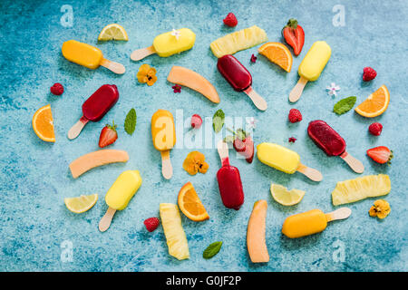 popsicle background on slate, flat lay from above Stock Photo