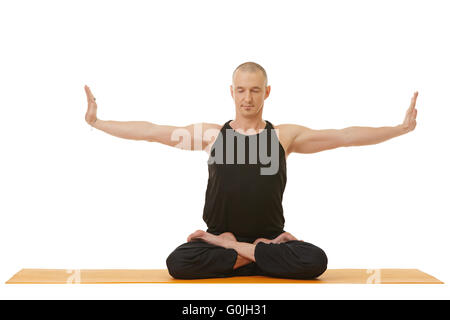 Image of concentrated man doing yoga exercise Stock Photo