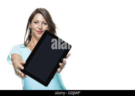 Pretty Woman Browsing at her Tablet Computer Stock Photo