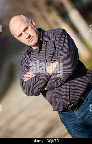 Confident attractive man standing waiting Stock Photo