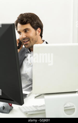 Successful businessman working in his office Stock Photo