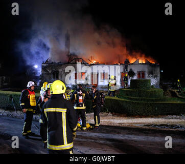 Petersfield, Hampshire, UK. 1st May, 2016. A Thatched property  has been totally gutted  also leaving One Person who has  been treated at the scene with a second person being taken to hospital by ambulance.   The alarm was raised by a quick thinking  passing member of the public who alerted the owners who had just sat down to eat their dinner.  Forty Firefighters were sent to  tackle the blaze in East Moen Road in the village of Langrish just outside Petersfield in Hampshire.     A neighbour living in the near The Close who asked not to be named said:' “It was about 8. Credit:  uknip/Alamy Liv Stock Photo