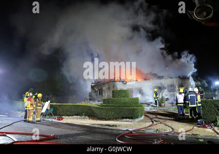 Petersfield, Hampshire, UK. 1st May, 2016. A Thatched property  has been totally gutted  also leaving One Person who has  been treated at the scene with a second person being taken to hospital by ambulance.   The alarm was raised by a quick thinking  passing member of the public who alerted the owners who had just sat down to eat their dinner.  Forty Firefighters were sent to  tackle the blaze in East Moen Road in the village of Langrish just outside Petersfield in Hampshire.     A neighbour living in the near The Close who asked not to be named said:' “It was about 8. Credit:  uknip/Alamy Liv Stock Photo