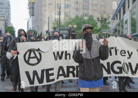 Seattle, WA, USA. 1st May, 2016. A group of anarchists pose before photographers. Maria S./Alamy Live News Stock Photo