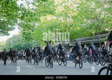 Seattle, WA, USA. 1st May, 2016. Protesters are closely followed and contained by a bicycle squad. Maria S./Alamy Live News Stock Photo