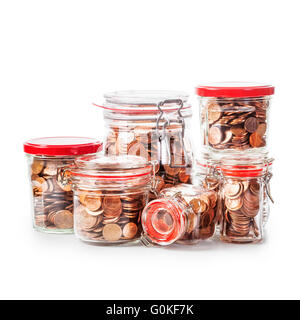 Glass bank jars with coins isolated on white background. Saving money concept. Group of objects with clipping path Stock Photo
