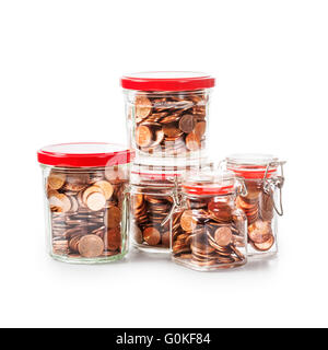 Glass bank jars with coins isolated on white background. Saving money concept. Group of objects with clipping path Stock Photo