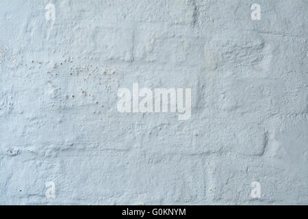 Background texture, white plaster on an old brickwall Stock Photo