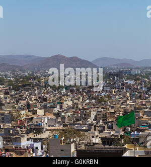 A view over rooftops in central Udaipur during the day. The Machla Hills can be seen in the distant. Stock Photo