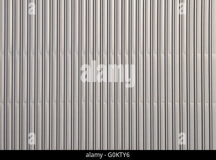 Unpainted aluminum grey corrugated goffered metal wall texture Stock Photo