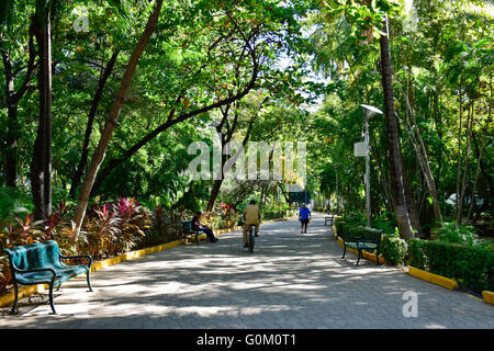 Mexican people walking in Papagayo Park, (Parque Papagayo), Acapulco, Mexico Stock Photo