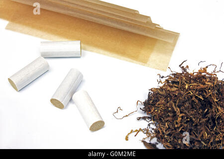 Tobacco filter tips and  riice papers isolated on white background Stock Photo