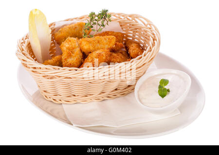 Crumbed chicken nuggets in a basket Stock Photo