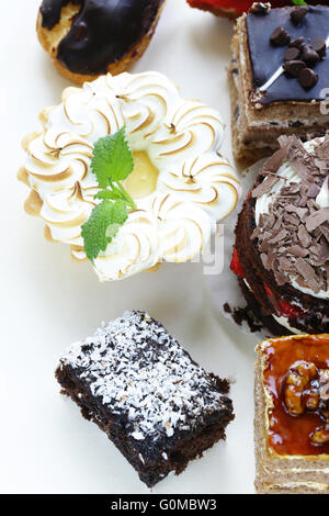 Assorted desserts, cakes and pastries on a white background Stock Photo