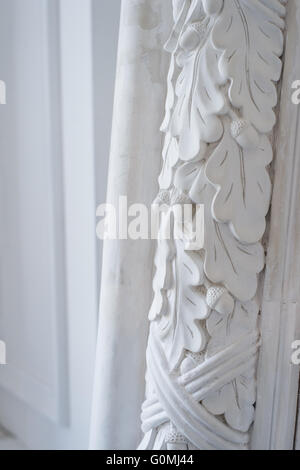 Beautiful elements of luxury wall design, white stucco mouldings over light background, antique plastering Stock Photo