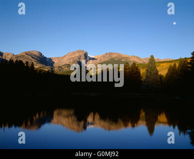 USA, Colorado, Rocky Mountain National Park, Hallett Peak reflects in Sprague Lake at sunrise. Stock Photo