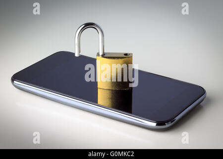 Unlocked padlock on mobile phone. Concept image for mobile phone security. Stock Photo