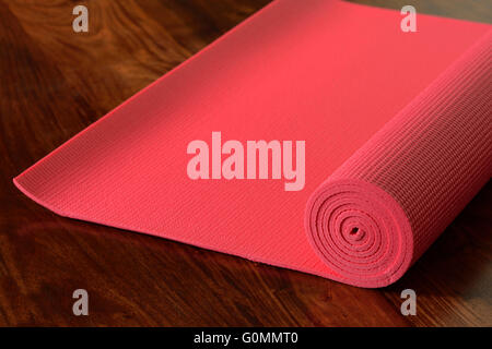 Yoga Mat on Wooden Floor Stock Photo