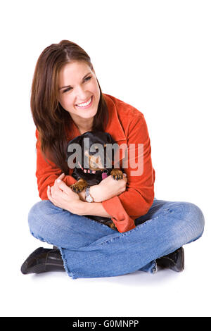 Series with women and pets, either a cat or dachshund.  Isolated on white. Stock Photo