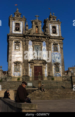 People in front of Church of Saint Ildefonso in Porto Stock Photo