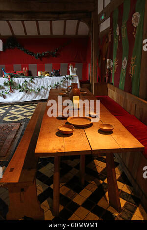 A long table ready for feasting in the great hall of barley house York Stock Photo