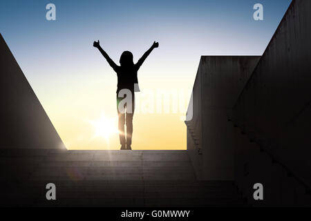 silhouette of woman or girl showing thumbs up Stock Photo