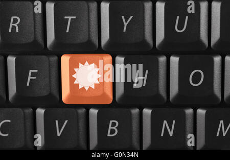 sun key on black keyboard Stock Photo