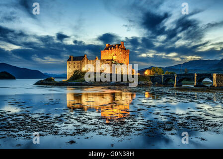 Eilean Donan Castle during blue hour after sunset. Stock Photo