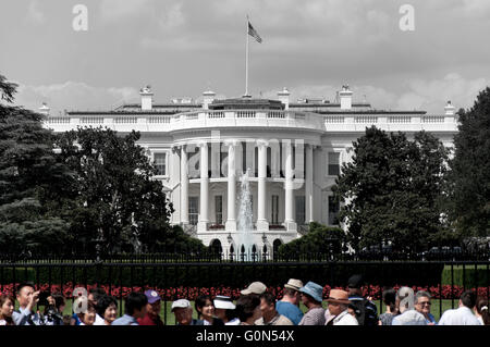 The White House in black and white with crowed in color. Stock Photo