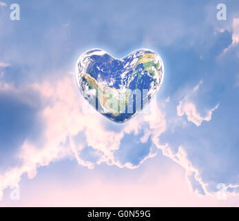 World in heart shape with over women human hands on blurred natural background: World Heart health day,Element of this image fur Stock Photo