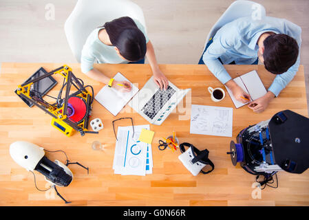 Pleasant students sitting at the table Stock Photo