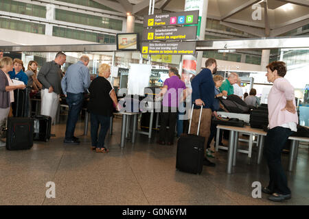 Air passengers going through airport security, Malaga airport, Spain, Europe Stock Photo