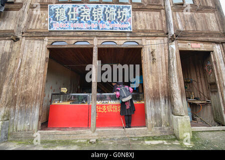 Yao woman in the village shop, Dazhai, Guangxi Autonomous Region, China Stock Photo